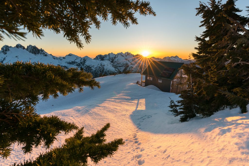 Mountain sunset over a custom home