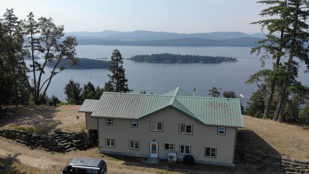 Two story house with the pacific Ocean in the background