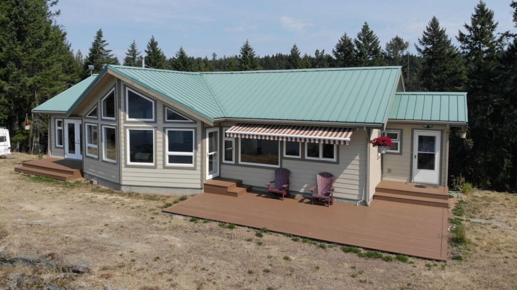 Expansive windows and a front facing deck allow these homeowners to appreciate their beautiful view