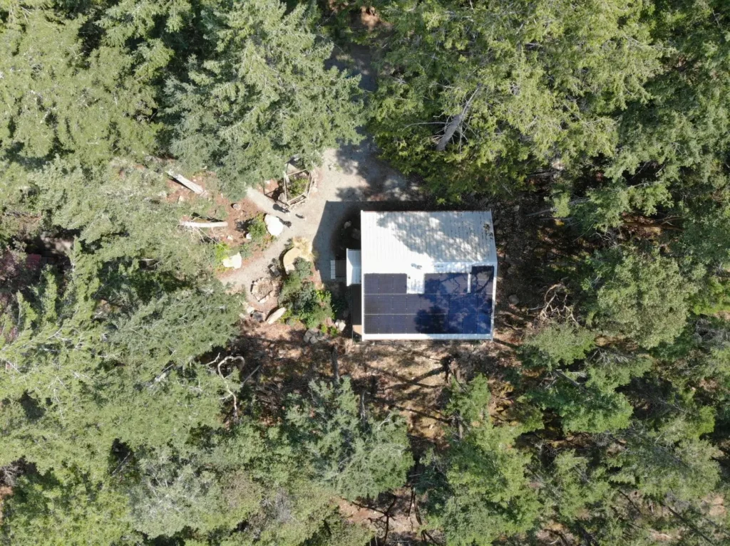 Rooftop solar panels power this cabin in the heart of one of BC's forests