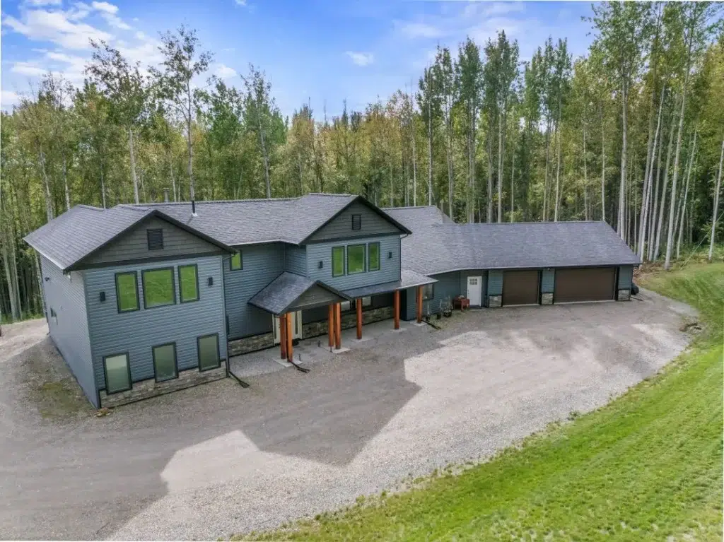 Custom Home with a full rancher style design one the main floor with guest bedrooms above