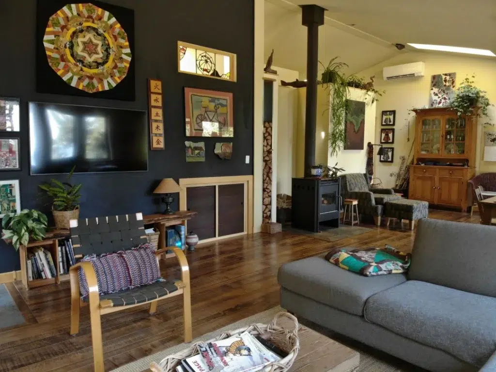 The wood burning fireplace perfectly encapsulates this property's commitment to being one with nature