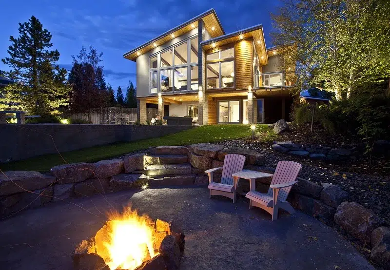 modern-prefab-with-outdoor-space A picturesque modern home sits above a cozy private fire pit