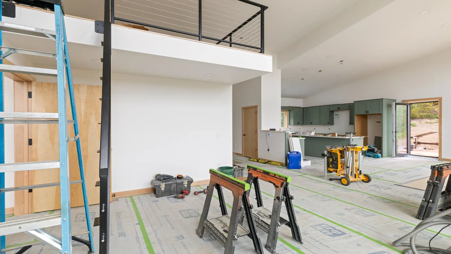 A spacious great room is highlighted by its high, vaulted ceilings