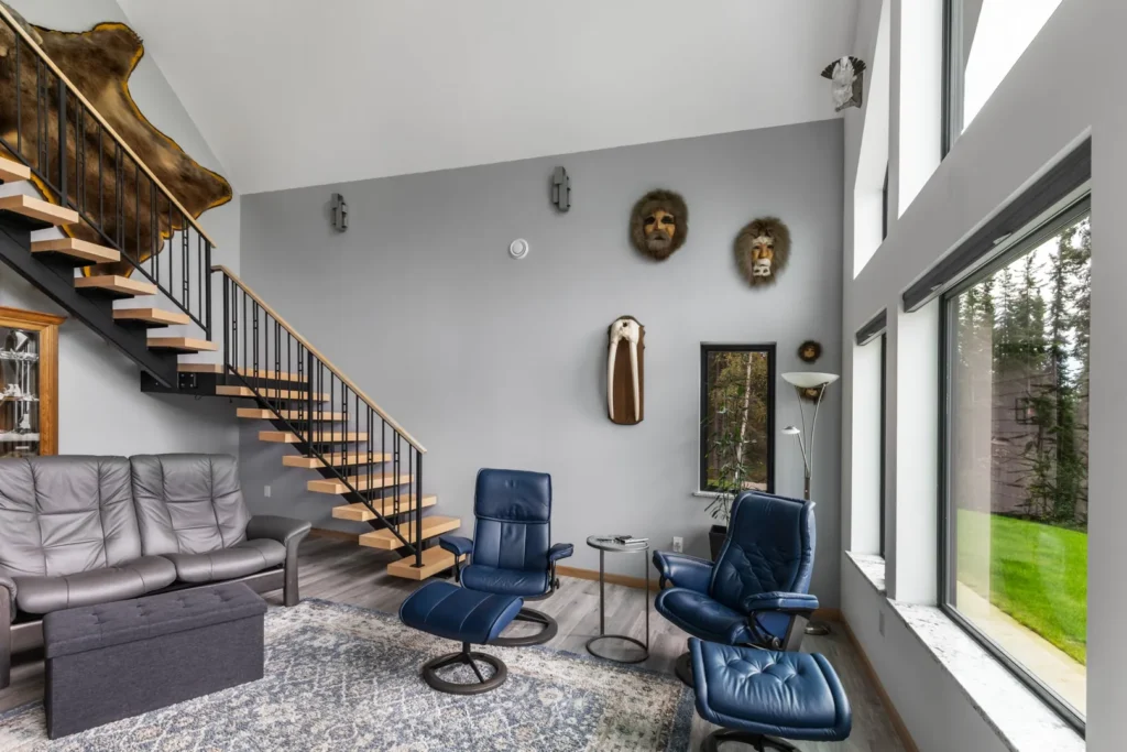 This living space has spacious windows that flood the indoors with lots of natural light